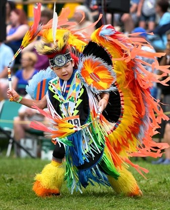 Young boy peforming during an event at the festival
