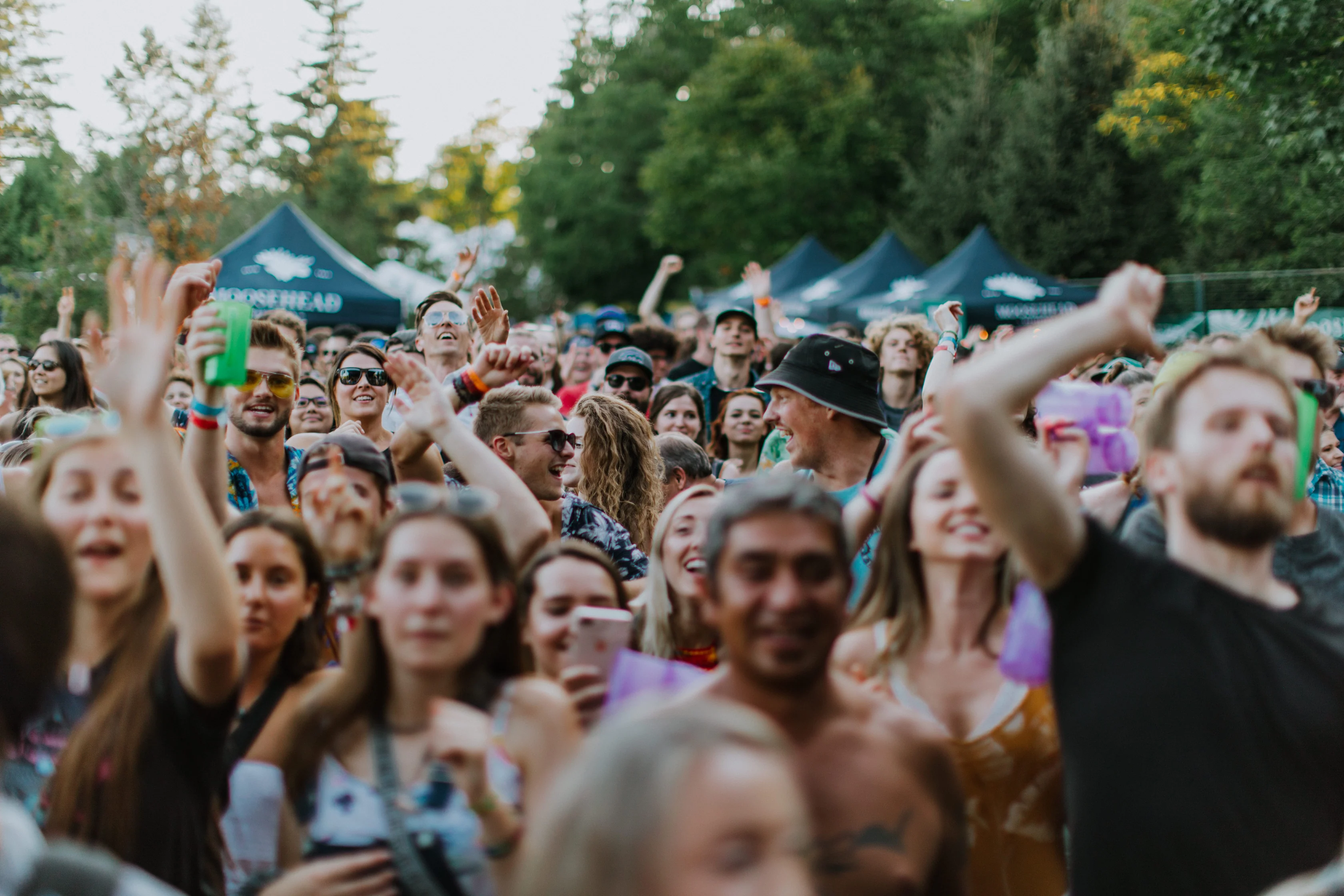 Group of attendees cheering on as they attend the River Festival